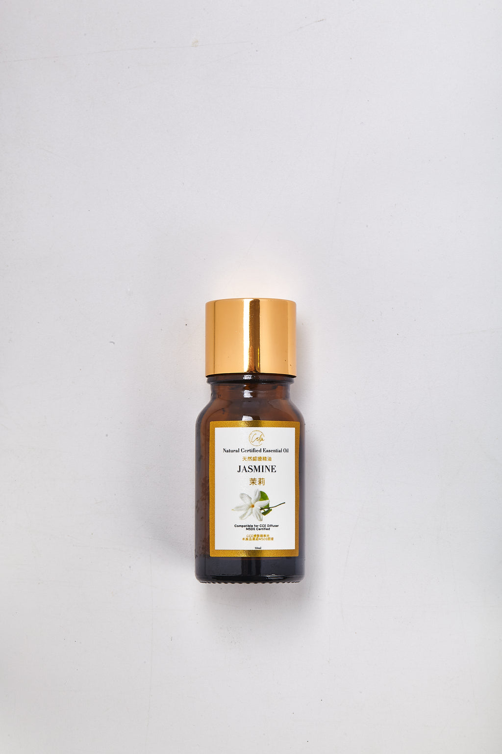 Bottle of Jasmine essential oil on a white background