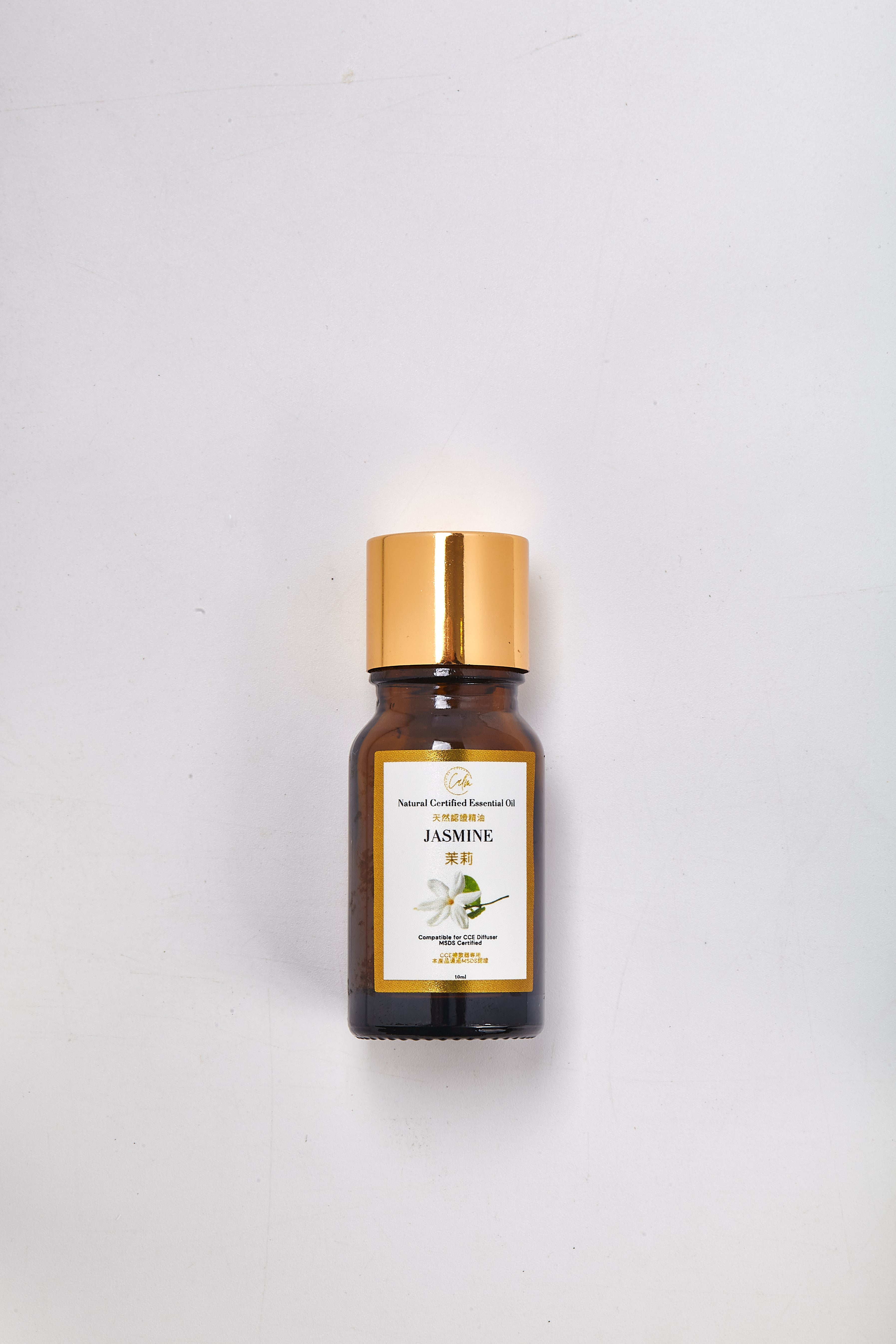 Bottle of Jasmine essential oil on a white background