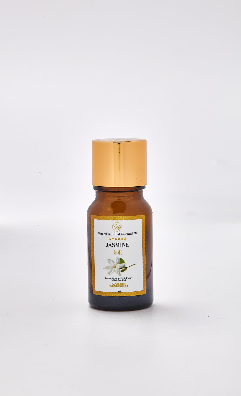 Bottle of jasmine essential oil with a gold cap on a white background